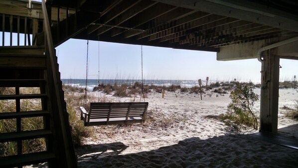 beach level swing and shade with outside hot and cold shower