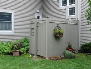 enclosed outdoor shower hot & cold settings with changing area