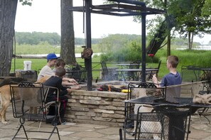 Kids and dogs enjoying lunch and a bonfire