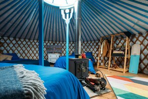 The Yurt sleeps six across one king size bed and two double beds