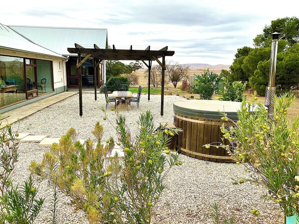 relaxing countryside views  under the pergola before or after using the hot tub!