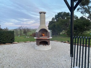 Wood fire pizza oven  or can be used just as a fire. Outdoor setting , hot tub