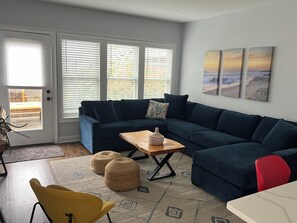 Spacious and comfortable living room with new sectional.