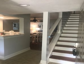 entry, stairs to 2 br, washer/dryer & bathroom