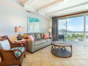 Living room with TV, sleeper sofa and ocean views
