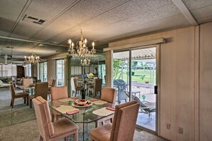 Sit down at the glass-top dining table for a home-cooked meal!