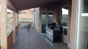 A long deck with plenty of covered space to safely watch evening thunderstorms.