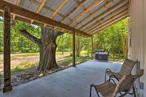 Sip your morning coffee on this vacation rental's covered patio!