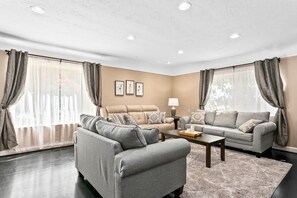 Stunning living room with TONS of natural light.