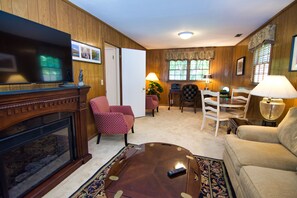 Downstairs den with 50": tv and faux fireplace