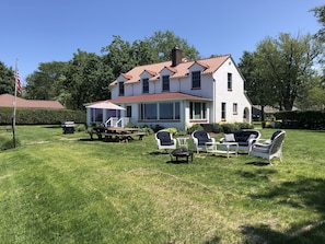 Large yard with plenty of seating and a picnic table