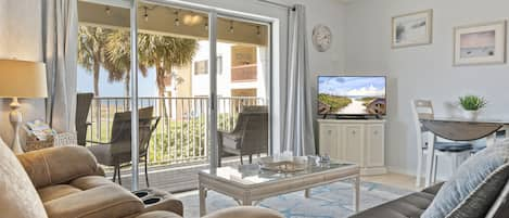 Open and airy living area with sliders out to a private balcony - Open and airy living area with sliders out to a private balcony