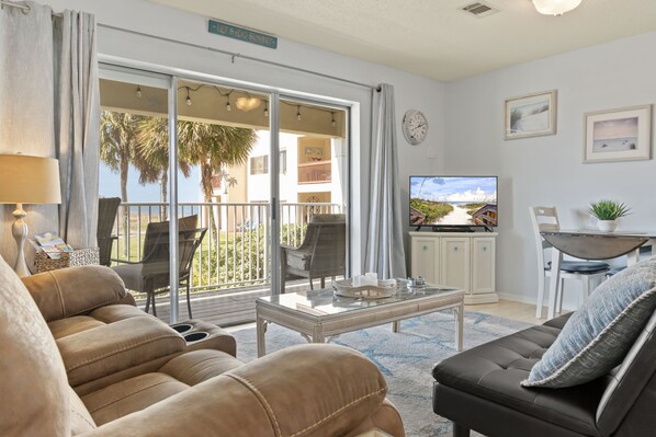 Open and airy living area with sliders out to a private balcony - Open and airy living area with sliders out to a private balcony