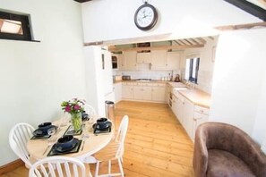 View through to the lovely hand-painted wooden kitchen