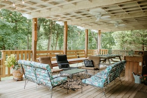 Deck overlooking the creek with room for all your guests.