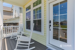 Front Porch w/ rocking chairs...  Sit & enjoy a cup of coffee or glass of wine!