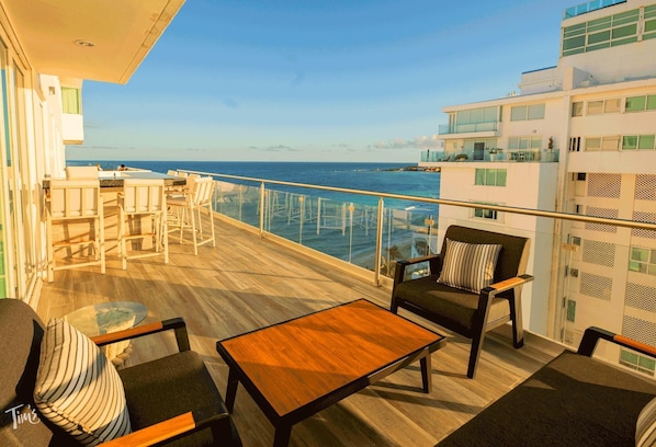 The Expansive Private Terrace Features a Brand New Sofa Set, Bar Stools, &amp; 2 Sun Loungers, purchased in 2024  Looking this Direction you have the Ocean View.