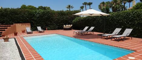 Private pool with sun loungers