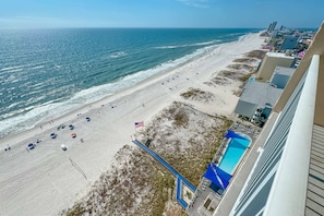 East-facing view of pool and beach from balcony