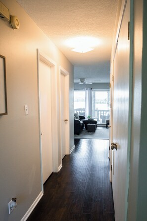 Coming into the condo with lake views down the hallway. 