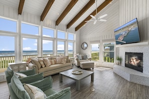 Open living space with soft, natural tones and luxurious design.