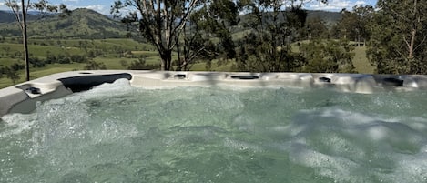 10 seater spa taking in the Paterson River valley and Barrington's range