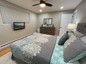 Cozy and Welcoming Master Bedroom with Queen Size Purple Mattress. 