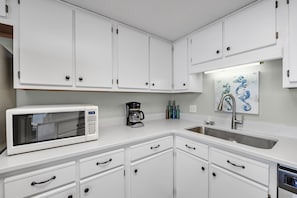 Newly updated Kitchen Features Stainless Steel Appliances and a Breakfast Bar