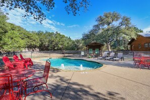 Large resort swimming pool with loungers