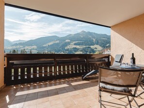 Sky, Property, Mountain, Cloud, Building, Wood, Porch, Interior Design, Shade, Table