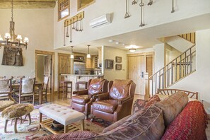Living room with chairs and a bench