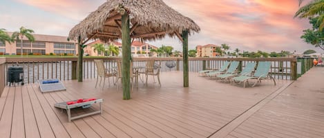 Large sundeck. Enjoy a game of cornhole and entertain under the tiki hut.  