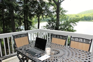 Work from anywhere.  Here is the perfect corner office - with a fantastic view.  There is even an outlet on the deck to keep your devices powered all day long!  Long term stays welcome in the off-season.