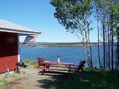 YOU CAN PARK RIGHT NEXT TO THE COTTAGE AND PICNIC TABLE OVERLOOKING THE OCEAN