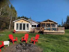 Oceanfront Starfish Cottage from the rear near the firepit.