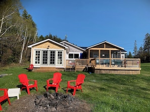 Oceanfront Starfish Cottage from the rear near the firepit.