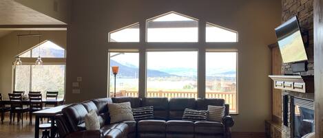 Main level Living Room overlooking lake.  3 recliners in sectional plus chair.