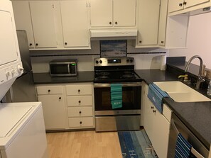 Kitchen with  Stainless Appliances W/ Washing Machine and Dryer in Unit! 