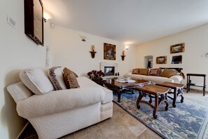 Living area is equipped with modern and rustic style furniture.