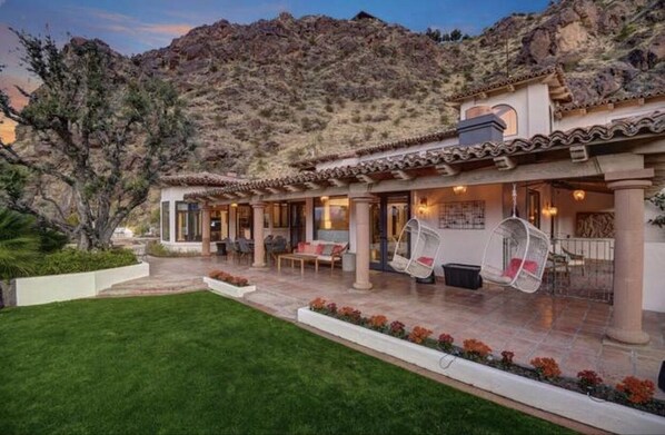 Large patio with mountain views and plenty of grass for the kids and dogs.