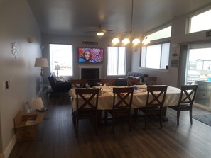 Picture from well stocked kitchen thru dining room to living room