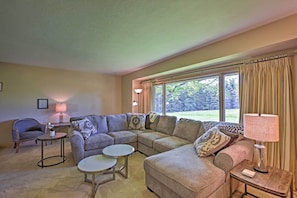 Lounge on the sectional sofa and look for birds through the large window.