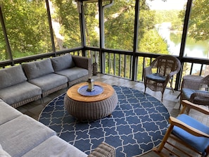Screened in porch with views of the lake and mountains
