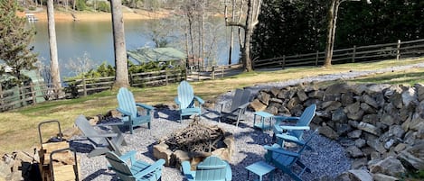 Fire pit, newly added in fenced back yard with lake views. 