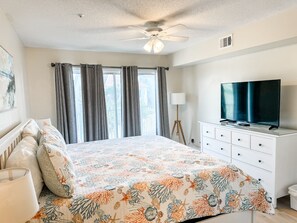 The master bedroom also has access to the balcony through sliding glass doors.