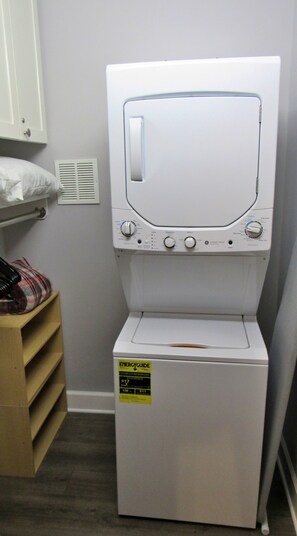 Bedroom closet includes washer and dryer and plenty of room for luggage