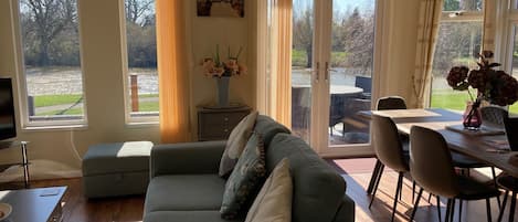 Living Room Views over the river with high ceilings and plenty of light.