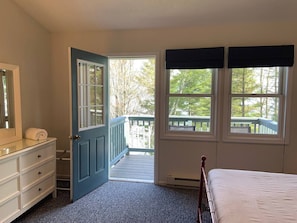 Bedroom features walk-out private lounge balcony overlooking Lake Superior and the Apostle Islands.