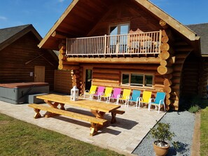 Patio with Lodge, hot tub and Spa building