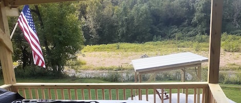 New jacuzzi overlooking the creek and swing porch 